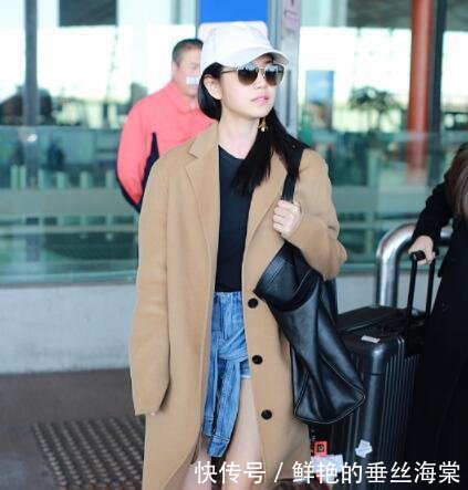 陈妍希真敢穿! 长风衣里藏了件牛仔短裤时尚又